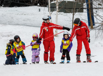 Ski instructors teaching beginners
