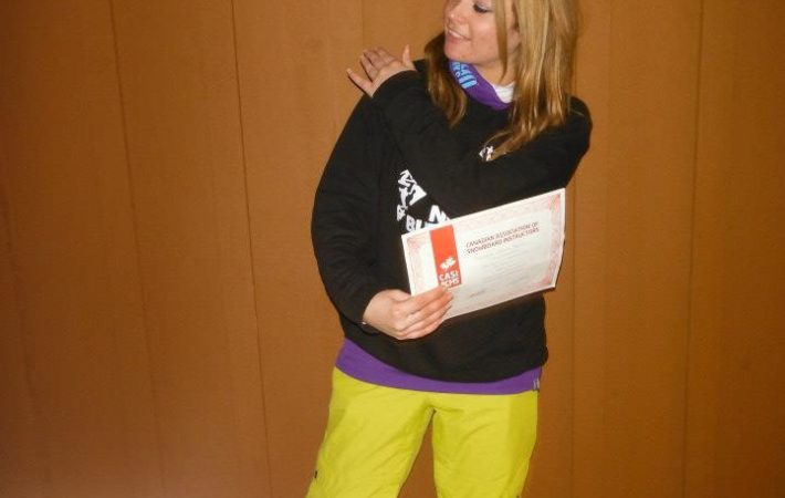 Joey passing her snowboard instructor exam